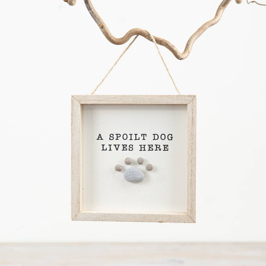 A Spoilt Dog Lives Here Pebble Sign